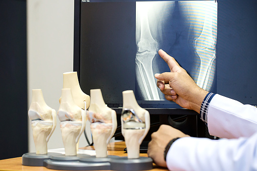 A doctor pointing at a computer screen, illustrating a medical presentation in Cottleville, MO
