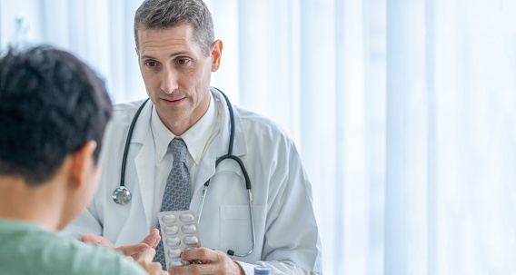 A physician engages in discussion with a patient in Cottleville, MO 