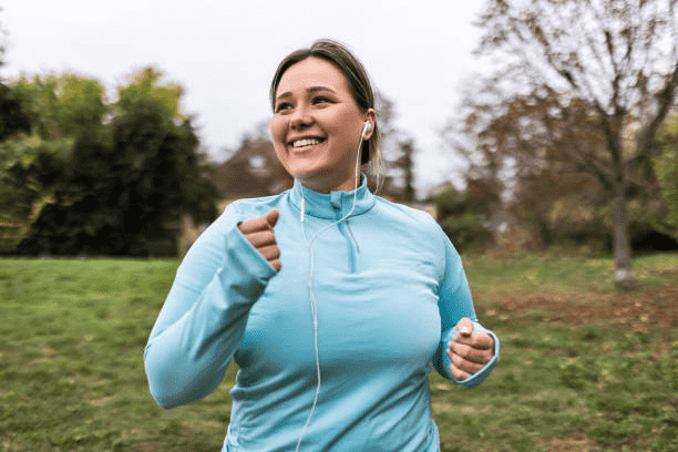 A women is running with her earphones on in Cottleville, MO